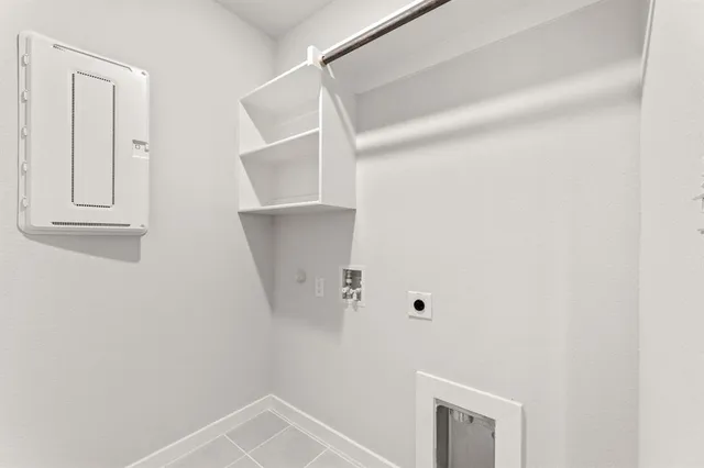 a view of storage and utility room with racks on the wall