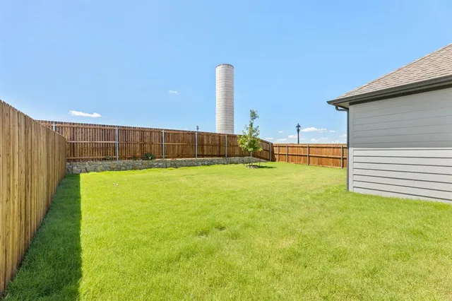 a view of a swimming pool with an outdoor space and seating area