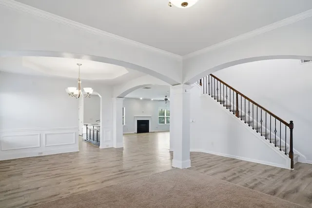 a view of a hallway with a chandelier