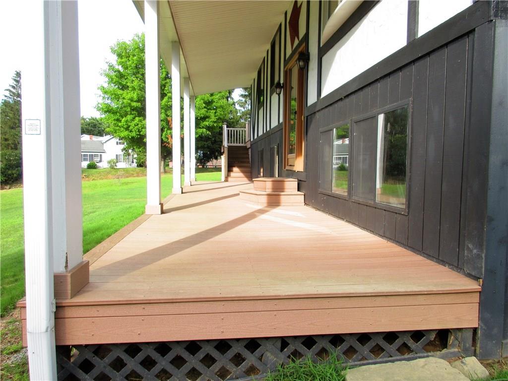 3598 Hadley Road Clarks Mills, PA 16114 - Photo 2 of 25 Enjoy the views on this huge 44x8' covered front porch with stunning columns and composite decking boards.