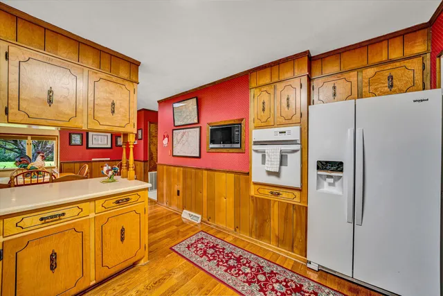 a view of a dining room with furniture and a flat screen tv