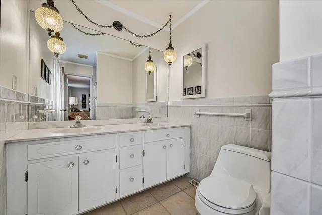 a bedroom with a bed and a bookshelf