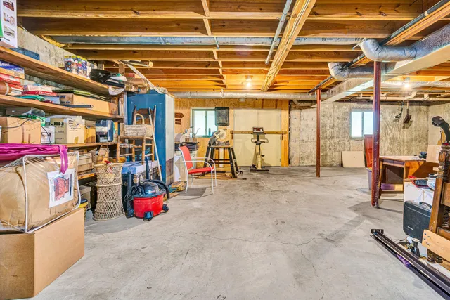an aerial view of residential house with beach and mountain view