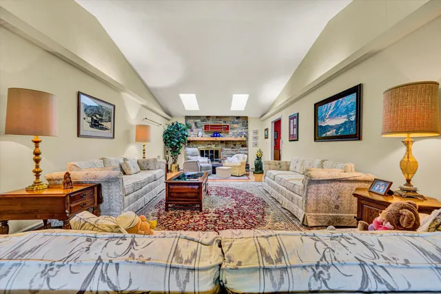 a living room with furniture and a rug