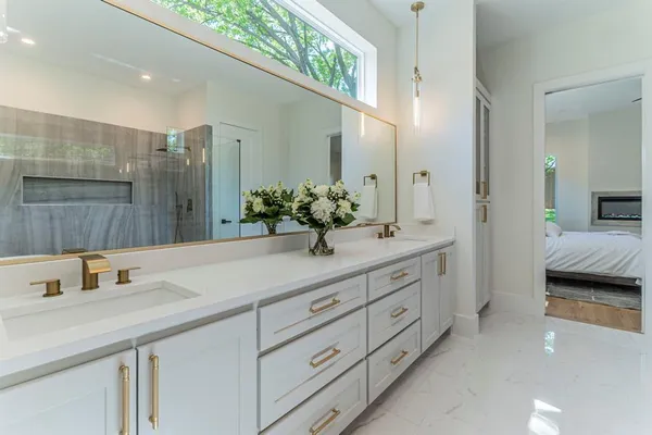 a bathroom with a sink double vanity and shower