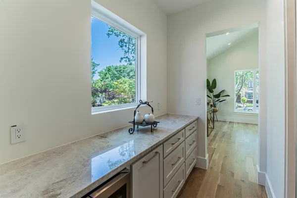 a bath room with sink and window