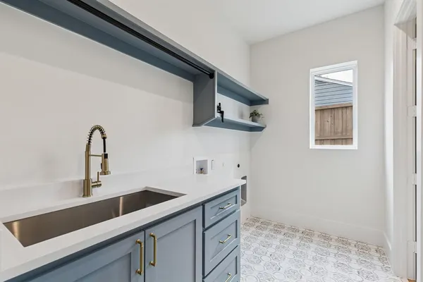 a kitchen with a sink and cabinets