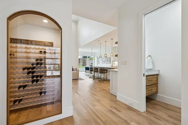 a view of a living room with furniture and wooden floor