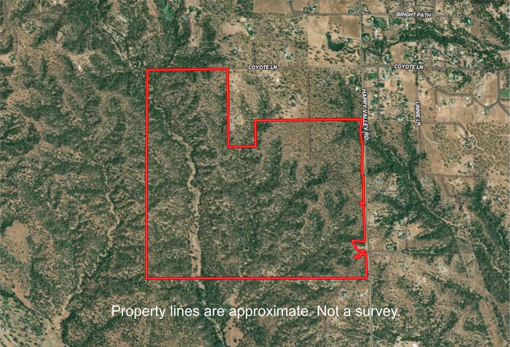 Happy Valley Road Cottonwood, CA 96022 - Photo 32 of 34 a view of a wooden house and a signage
