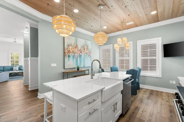 a large white kitchen with a large window