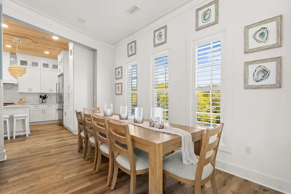 a view of a dining room with furniture and window
