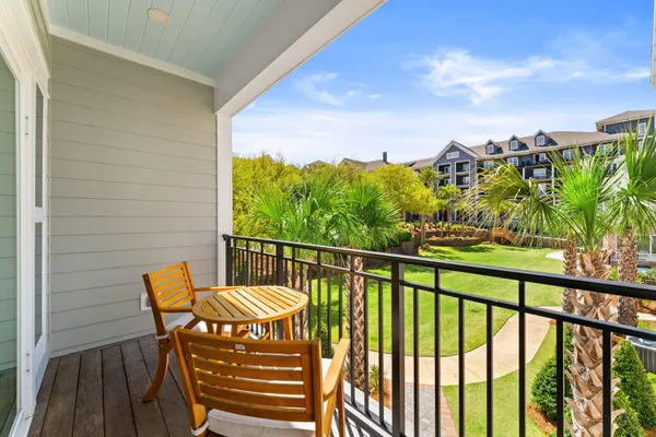 a view of a chairs and table in patio