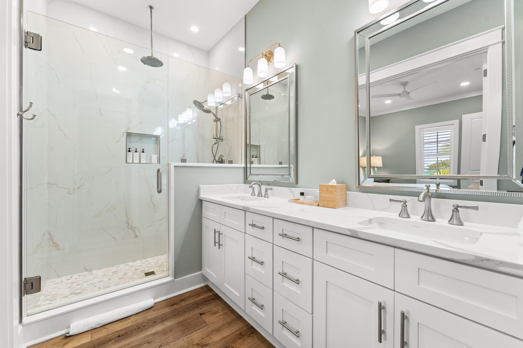 413 Henderson Cottage Way Destin, FL 32541 - Photo 21 of 48 a bathroom with double sink and a mirror