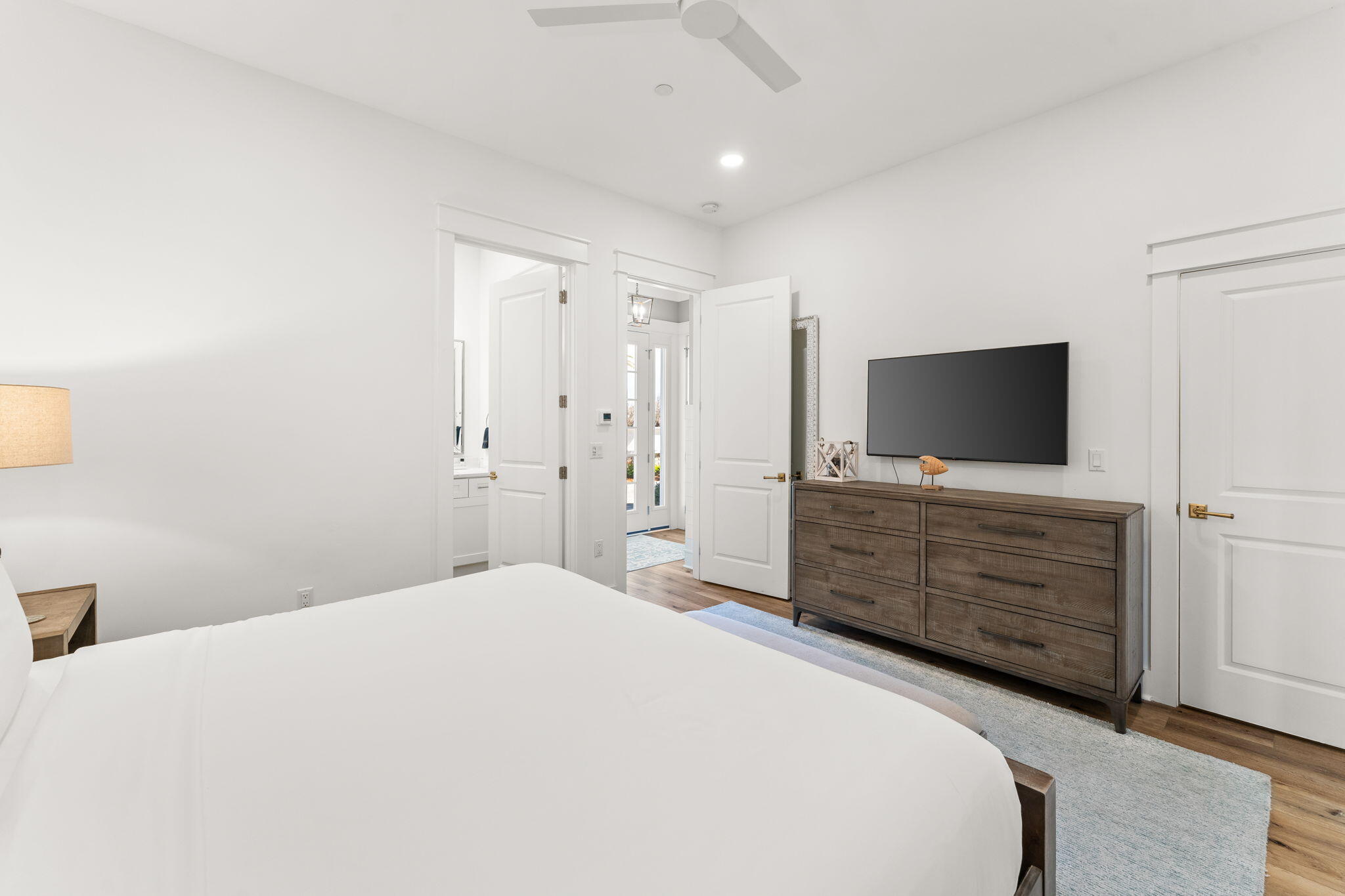 413 Henderson Cottage Way Destin, FL 32541 - Photo 25 of 48 a bedroom with a bed and flat screen tv