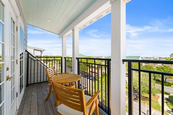 a view of a balcony with wooden floor