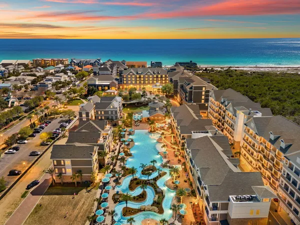 an aerial view of residential building and ocean