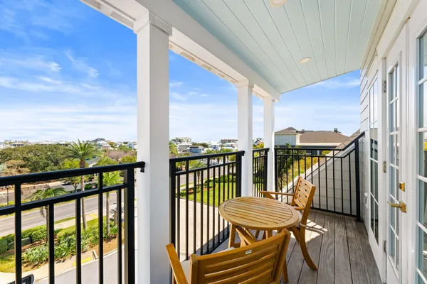 a view of a balcony with chairs