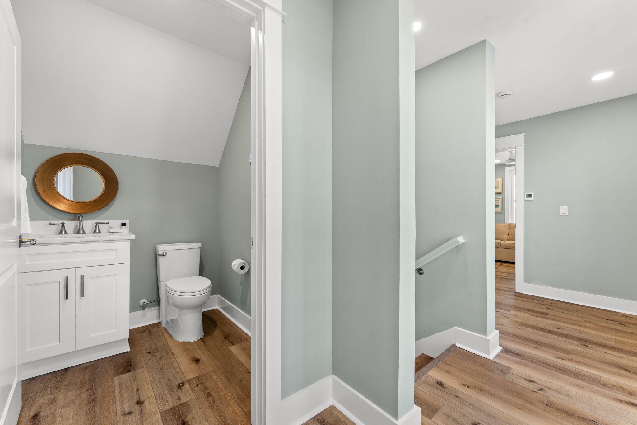 413 Henderson Cottage Way Destin, FL 32541 - Photo 32 of 48 a bathroom with a toilet a sink and a mirror