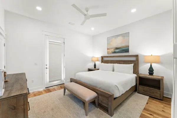 a bedroom with a bed and a lamp