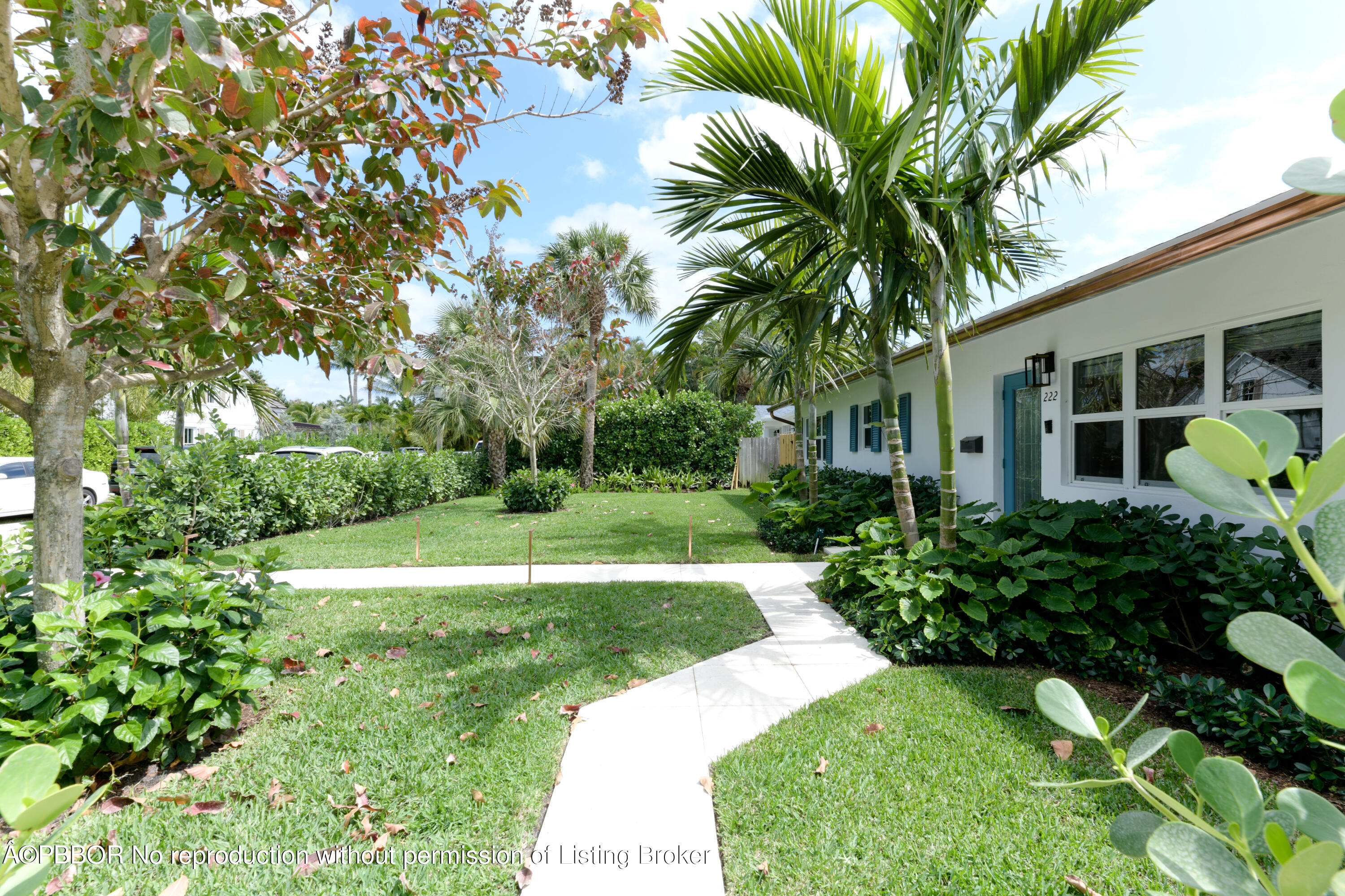 222 Pilgrim Road West Palm Beach, FL 33405 - Photo 2 of 12 a view of a garden with a house