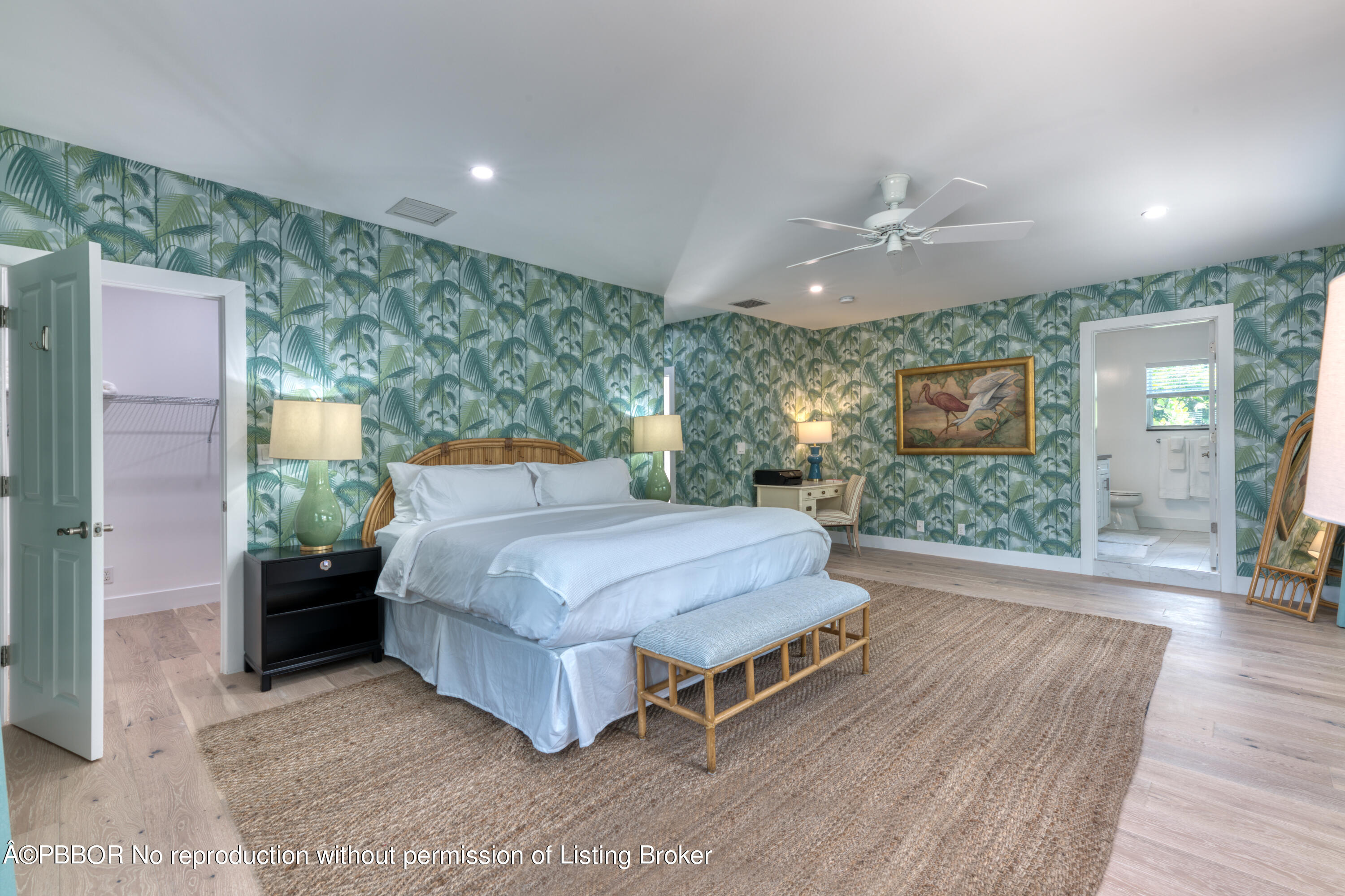 222 Pilgrim Road West Palm Beach, FL 33405 - Photo 6 of 12 a spacious bedroom with a bed and wooden floor