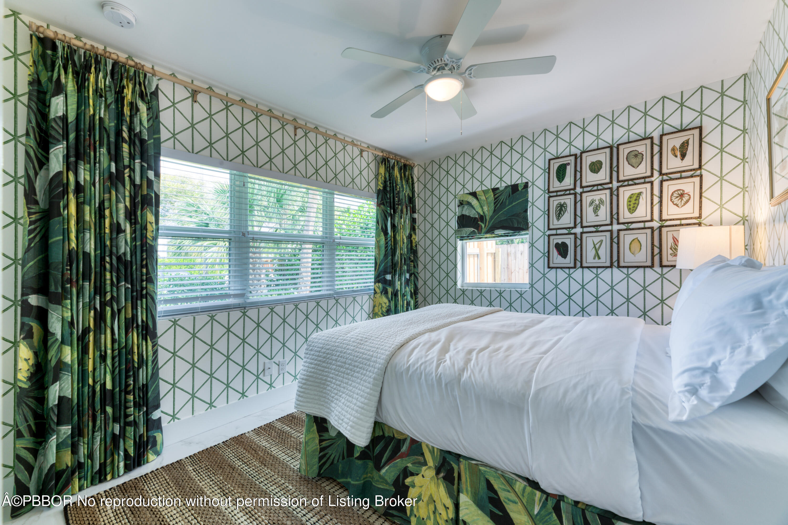 222 Pilgrim Road West Palm Beach, FL 33405 - Photo 7 of 12 a bedroom with a bed and a large window