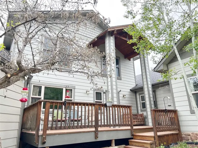 a view of a wooden chairs and a small deck