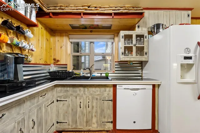 a bathroom with a sink a mirror and a shower