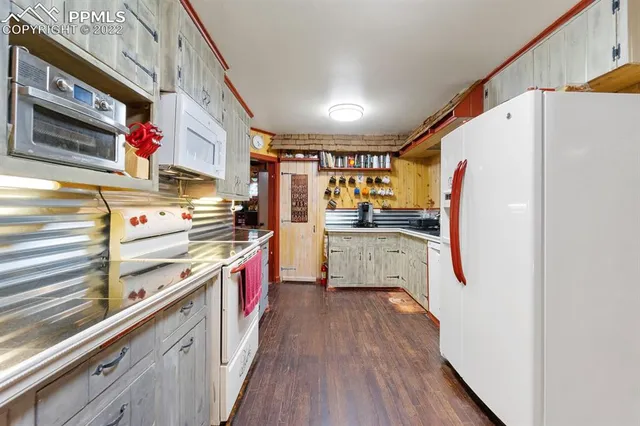 a bedroom with furniture and a large window