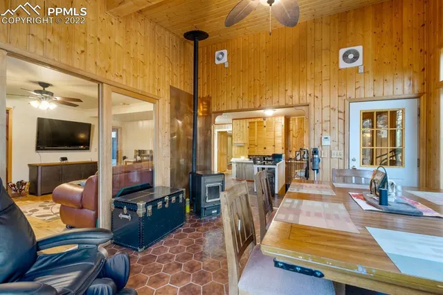 a bedroom with a bed wooden floor and window