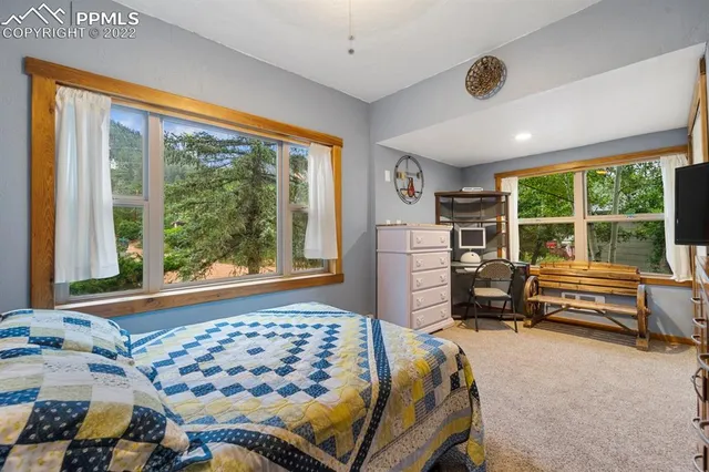 a view of a roof deck with wooden floor and fence