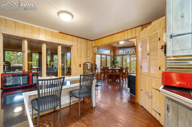 a view of a chairs and table in the patio