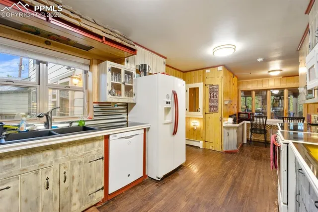 a white toilet sitting next to a bathroom sink