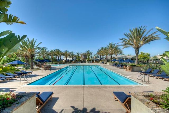 an aerial view of a residential houses with city view