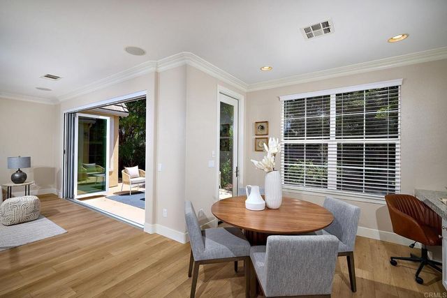 a view of a dining room with furniture and window