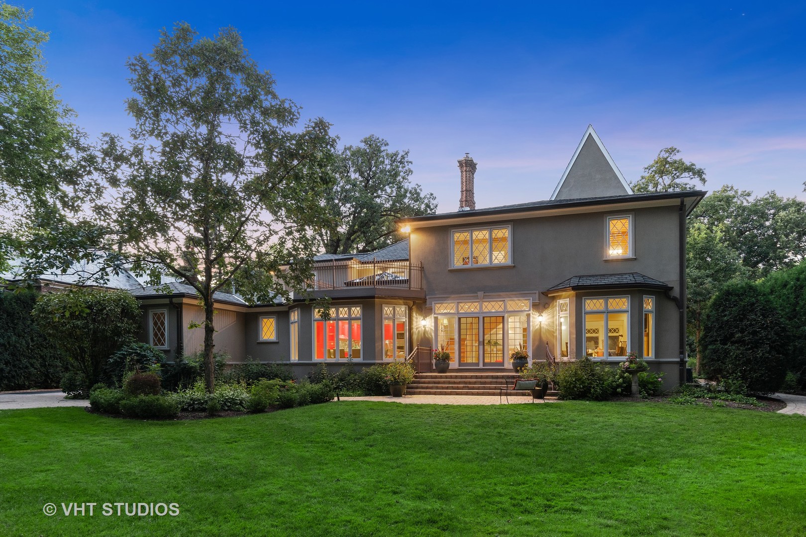 24 Warwick Road Winnetka, IL 60093 - Photo 4 of 8 a front view of a house with a yard