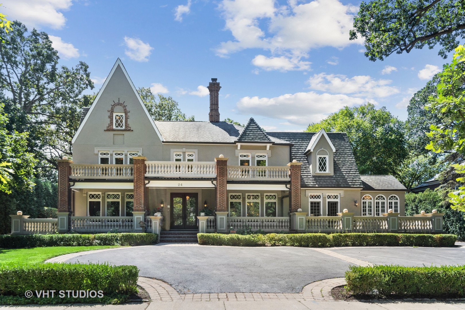 24 Warwick Road Winnetka, IL 60093 - Photo 6 of 8 front view of residential houses with a yard