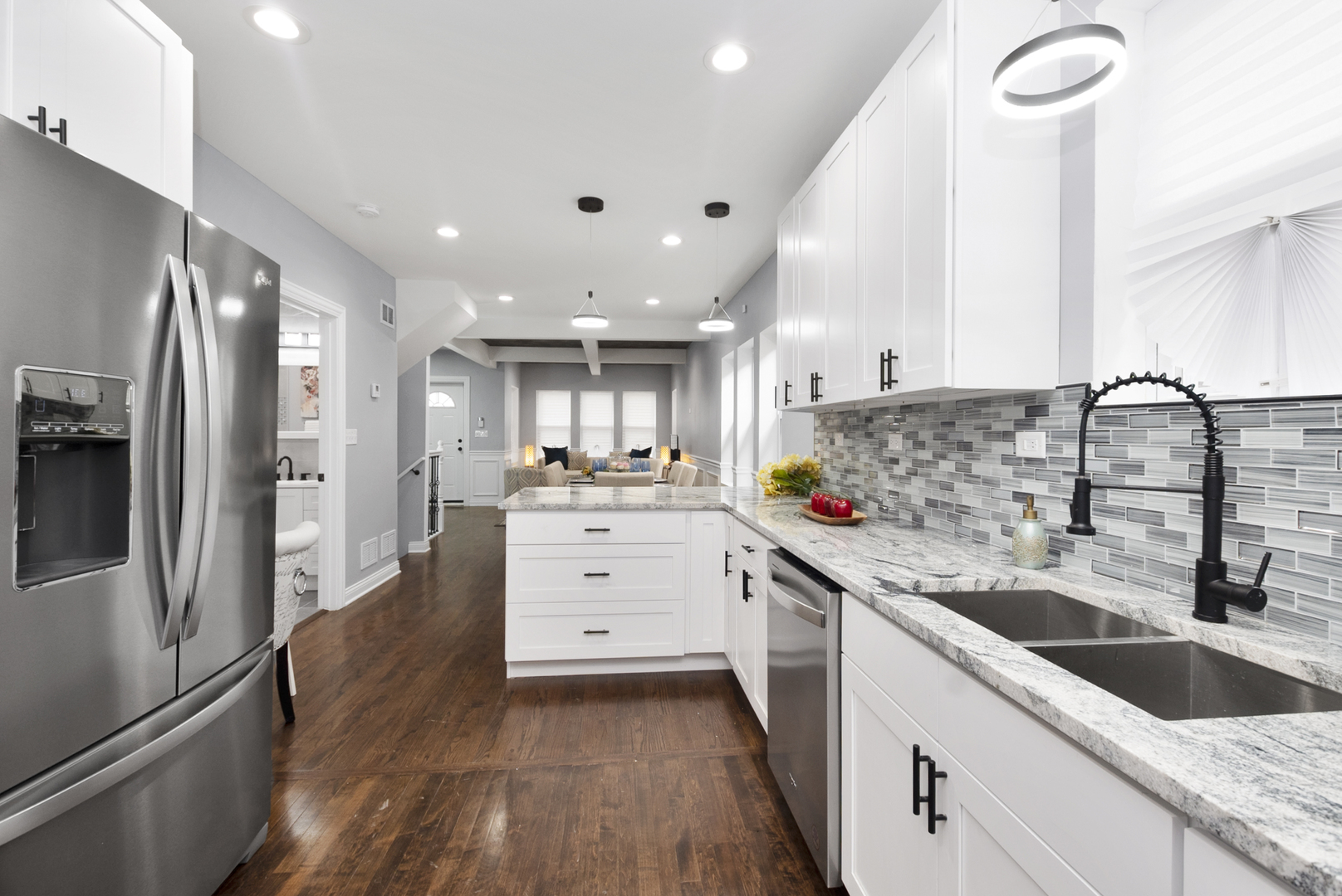 643 East 89th Street Chicago, IL 60619 - Photo 11 of 28 a kitchen with granite countertop a sink stainless steel appliances and cabinets