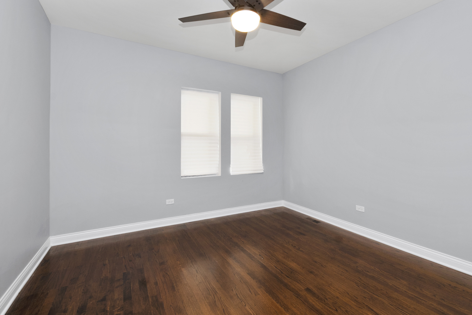 643 East 89th Street Chicago, IL 60619 - Photo 12 of 28 wooden floor in an empty room with a window