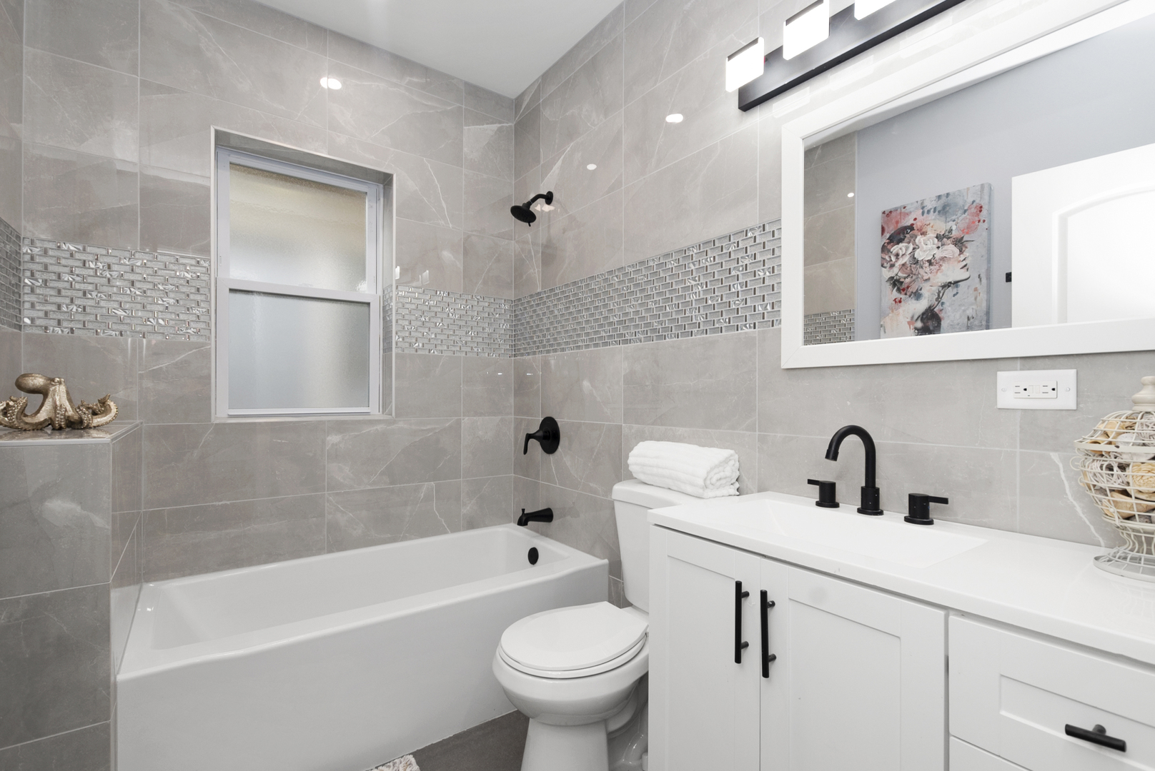 643 East 89th Street Chicago, IL 60619 - Photo 14 of 28 a bathroom with a sink a toilet and a bathtub