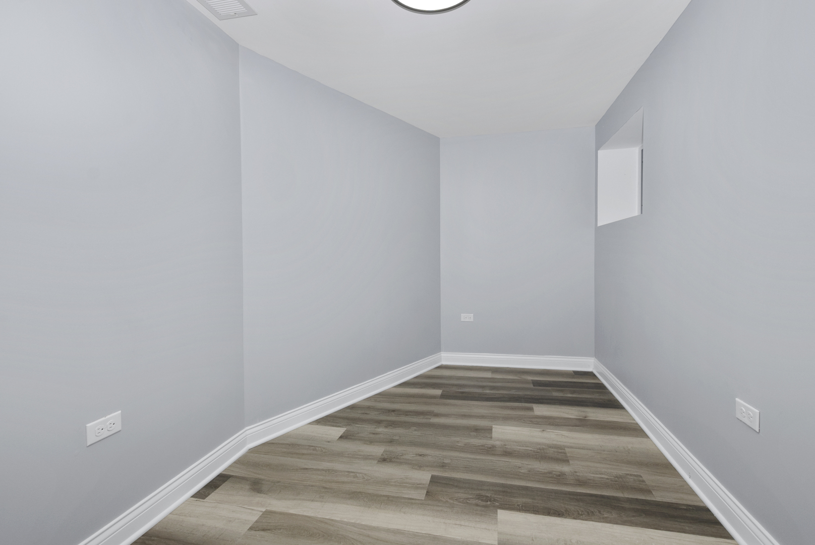 643 East 89th Street Chicago, IL 60619 - Photo 19 of 28 a view of a small space with wooden floor