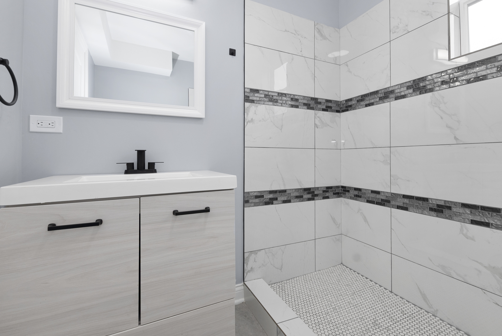 643 East 89th Street Chicago, IL 60619 - Photo 25 of 28 a bathroom with a shower sink and mirror