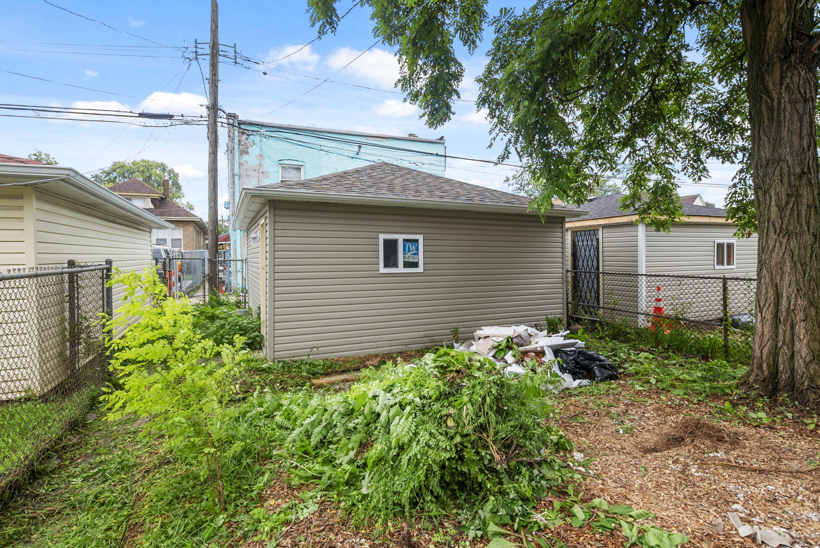 643 East 89th Street Chicago, IL 60619 - Photo 27 of 28 a backyard of a house with lots of green space