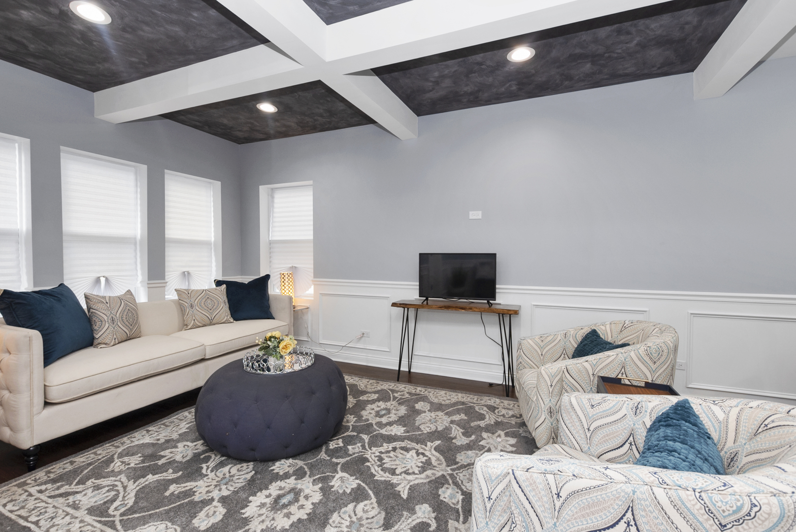 643 East 89th Street Chicago, IL 60619 - Photo 4 of 28 a living room with furniture and a flat screen tv