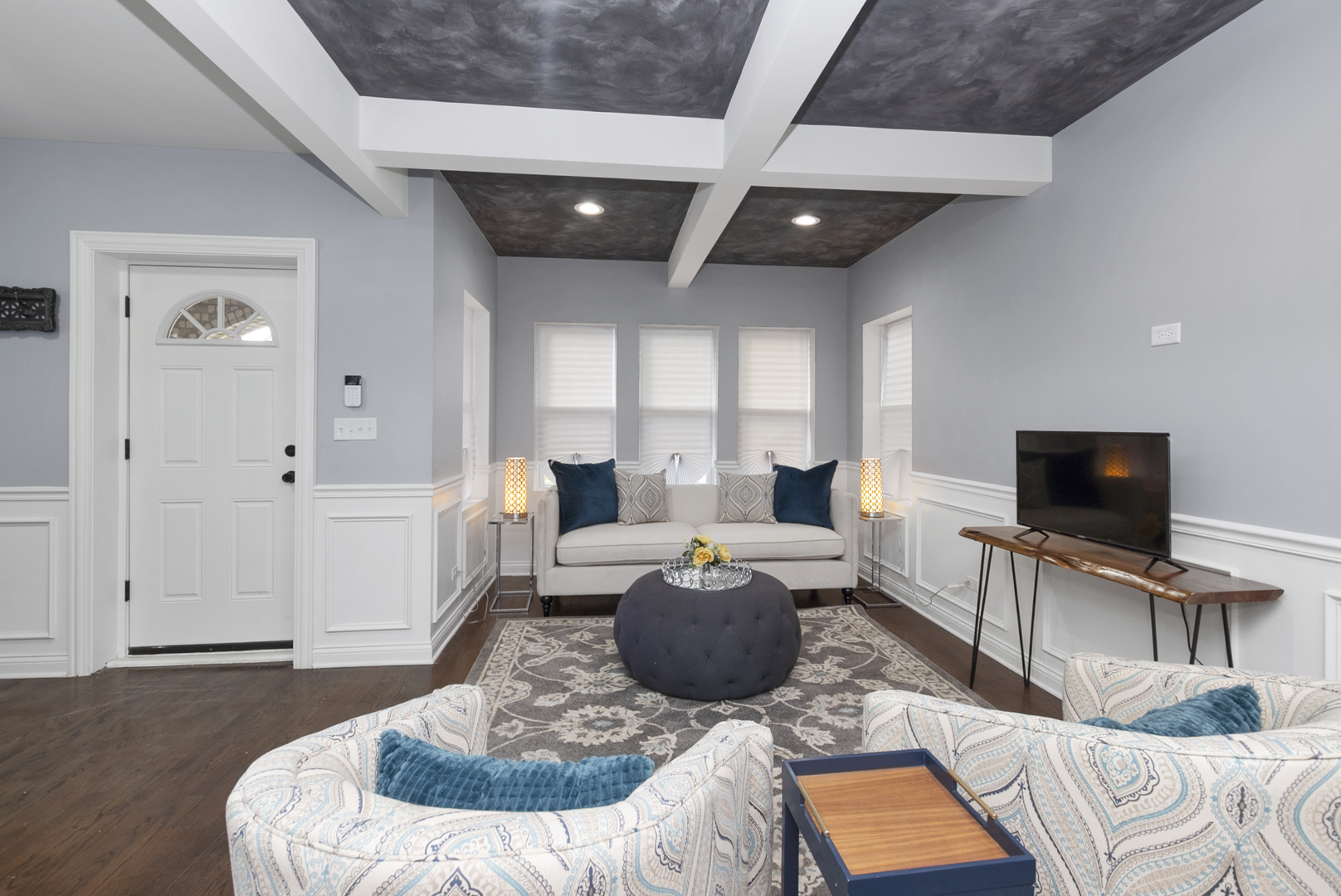 643 East 89th Street Chicago, IL 60619 - Photo 5 of 28 a living room with furniture and a flat screen tv