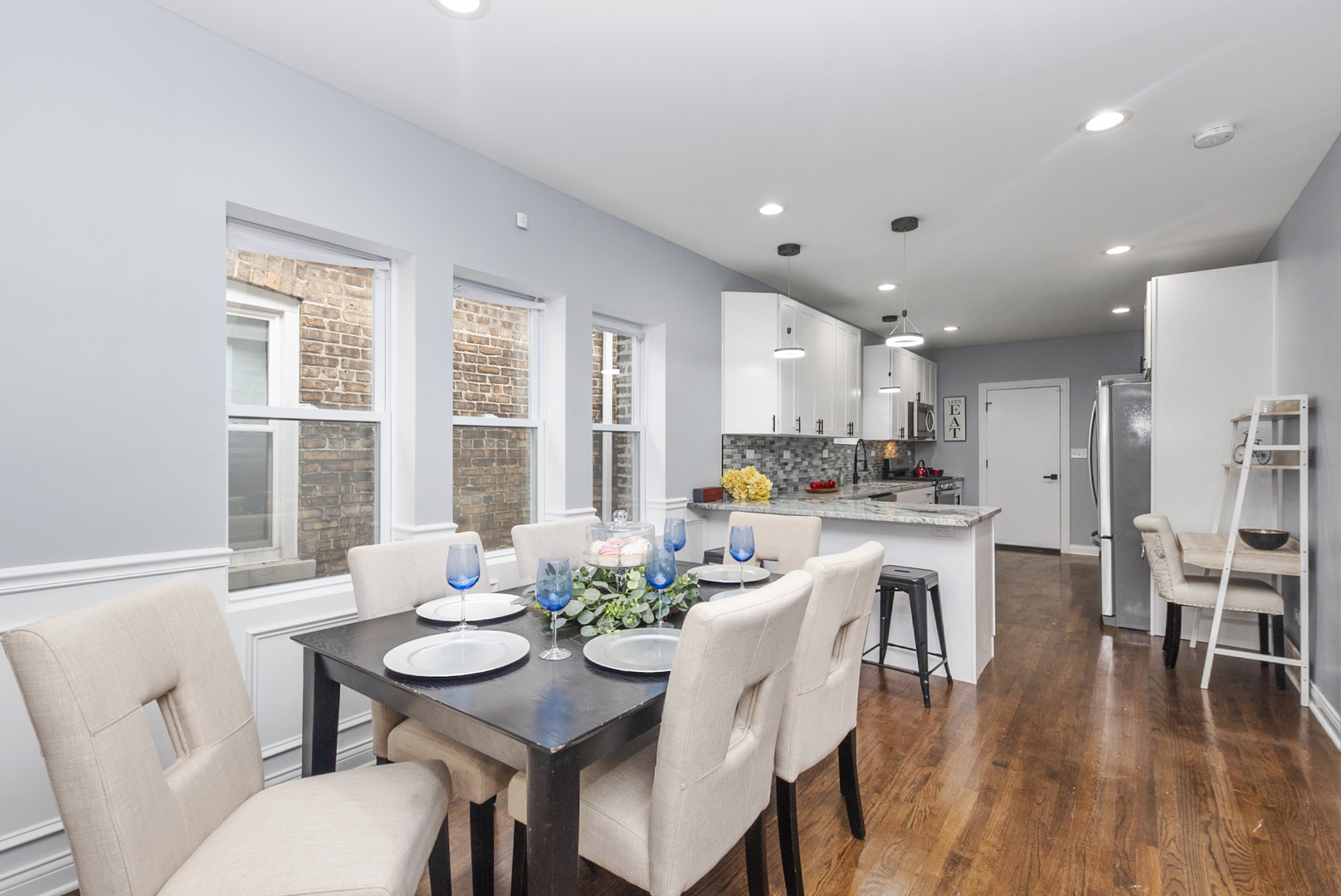 643 East 89th Street Chicago, IL 60619 - Photo 6 of 28 a view of a dining room with furniture window and wooden floor