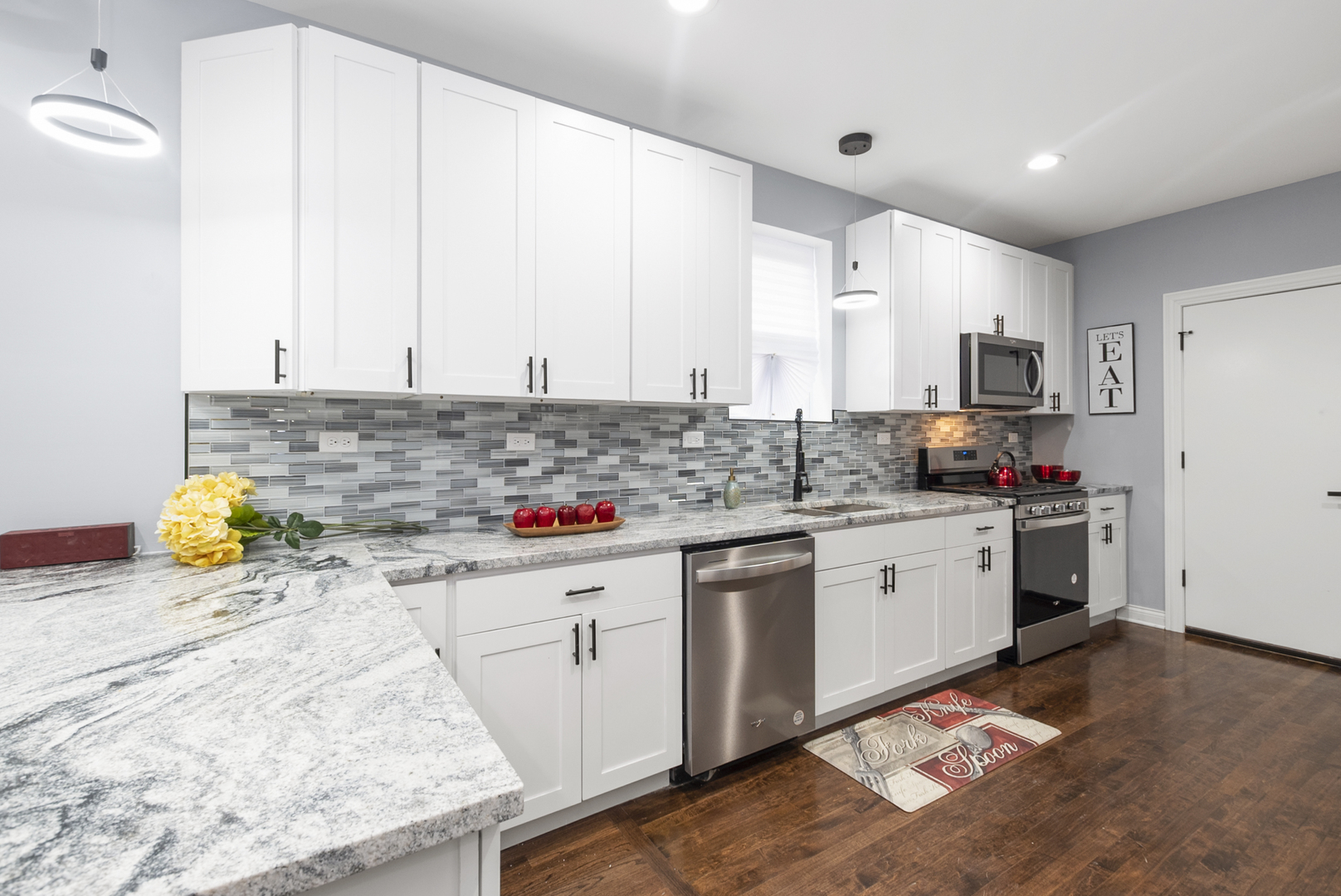643 East 89th Street Chicago, IL 60619 - Photo 9 of 28 a kitchen with stainless steel appliances granite countertop a stove a sink and a white refrigerator