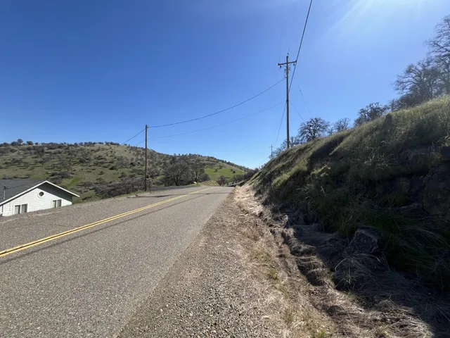 a view of a road with a building in the background