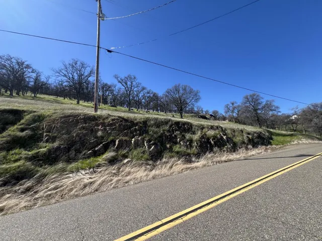 a view of a road with a yard