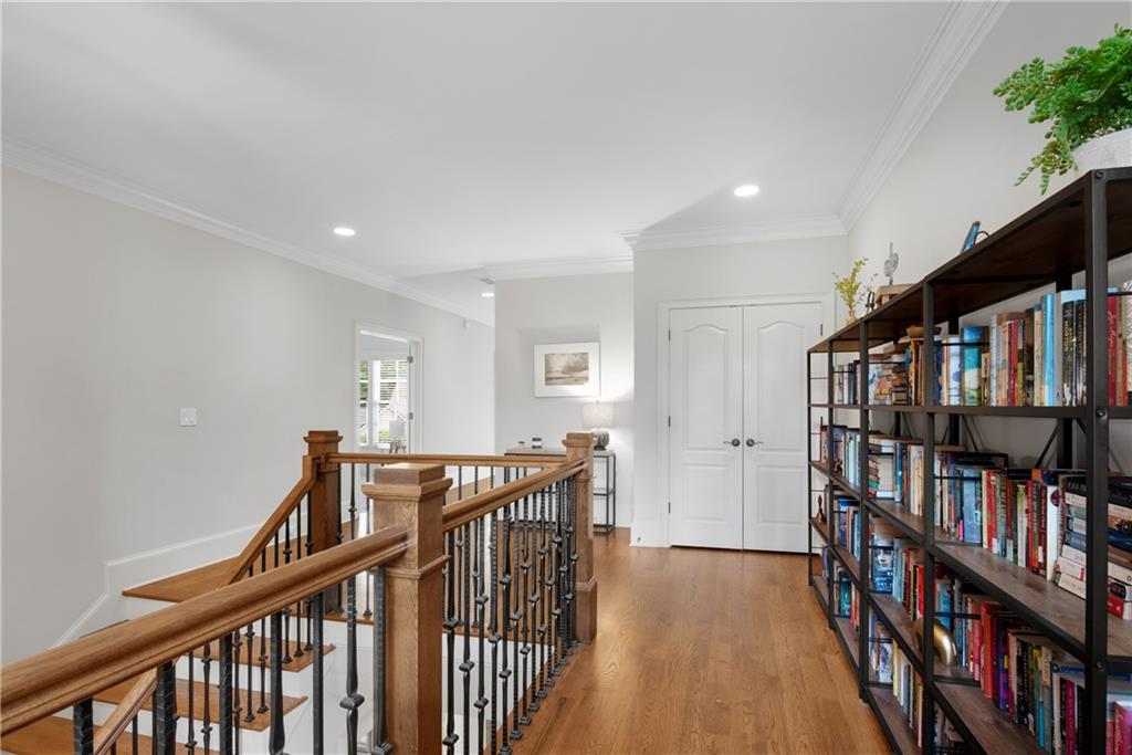 13942 Tree Loft Road Milton, GA 30004 - Photo 56 of 102 a view of a hallway with wooden floor and entryway